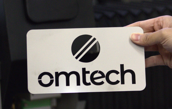 Clean cut OMTech logo cut by one of our fiber laser cutters 